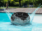 Mira pouf – knitted pouf made of recycled plastic in sparkling aqua