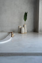 Vase Concrete Natural M – terracotta with raffia detail in an atmospheric style