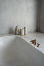 Vase Concrete Natural M – terracotta with raffia detail in an atmospheric style