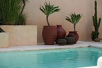 The Belly Vase – terracotta with rattan detail in black