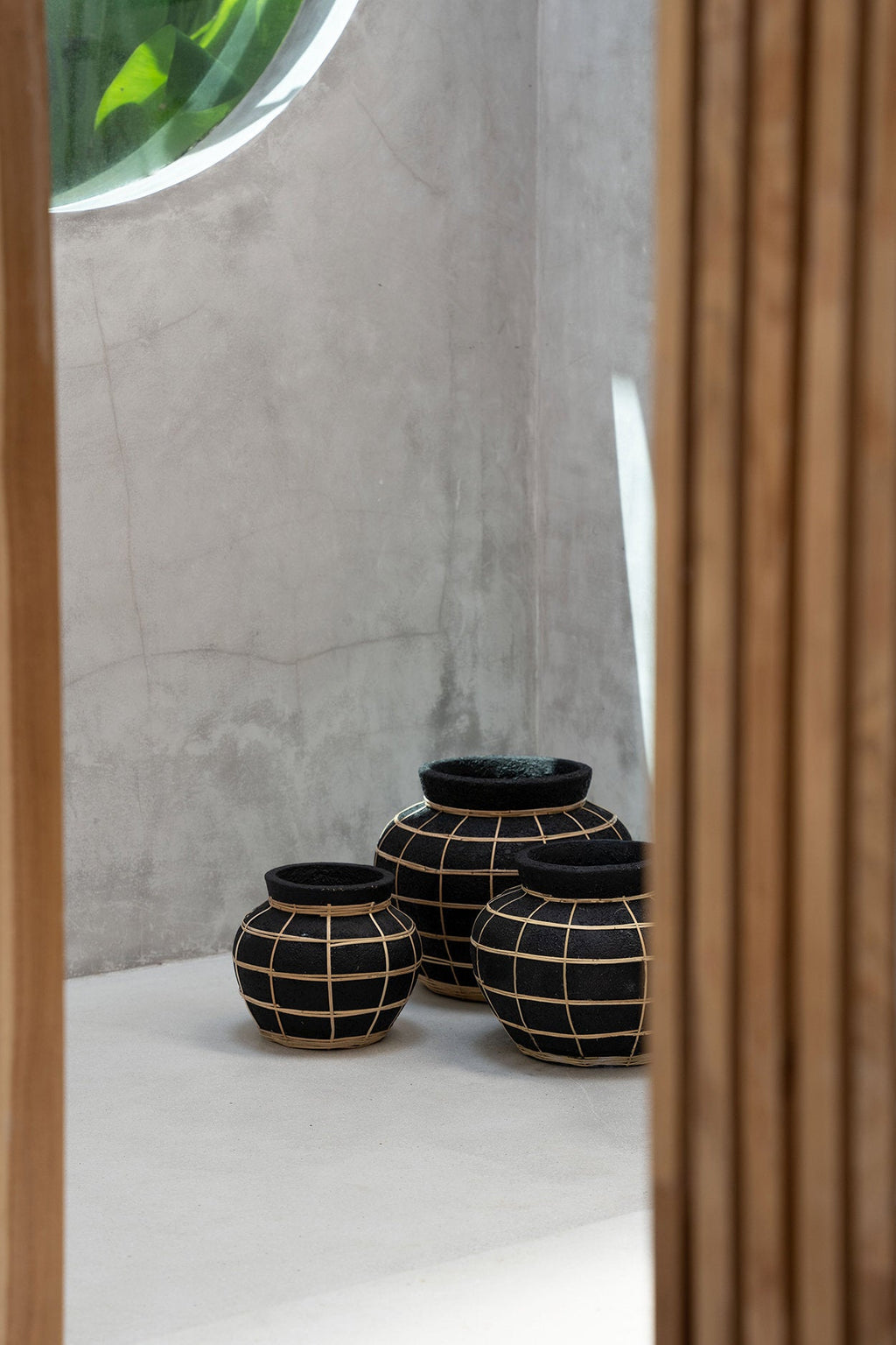 Belly vase M – terracotta with rattan detail in natural black